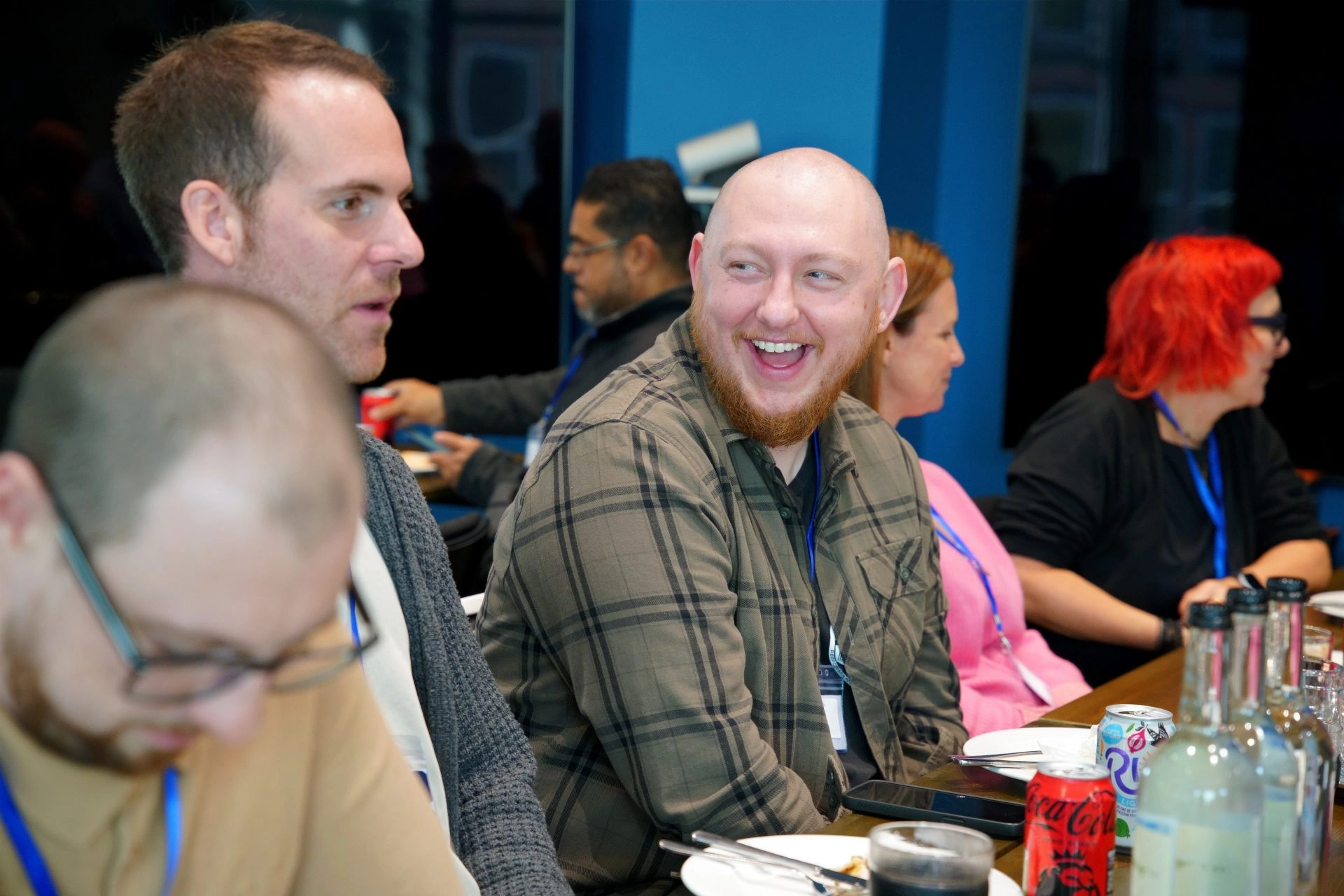 People engaged in a lively discussion during an event focused on innovative game-based STEAM education initiatives.