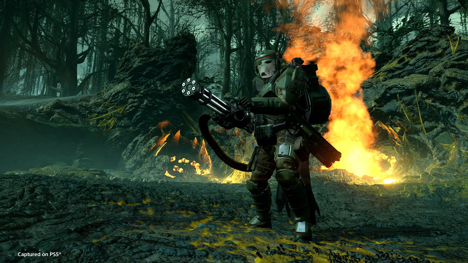 Helldivers combat scene featuring a soldier with a M-1000 Maxigun amidst flames, showcasing new weapons and strategy.