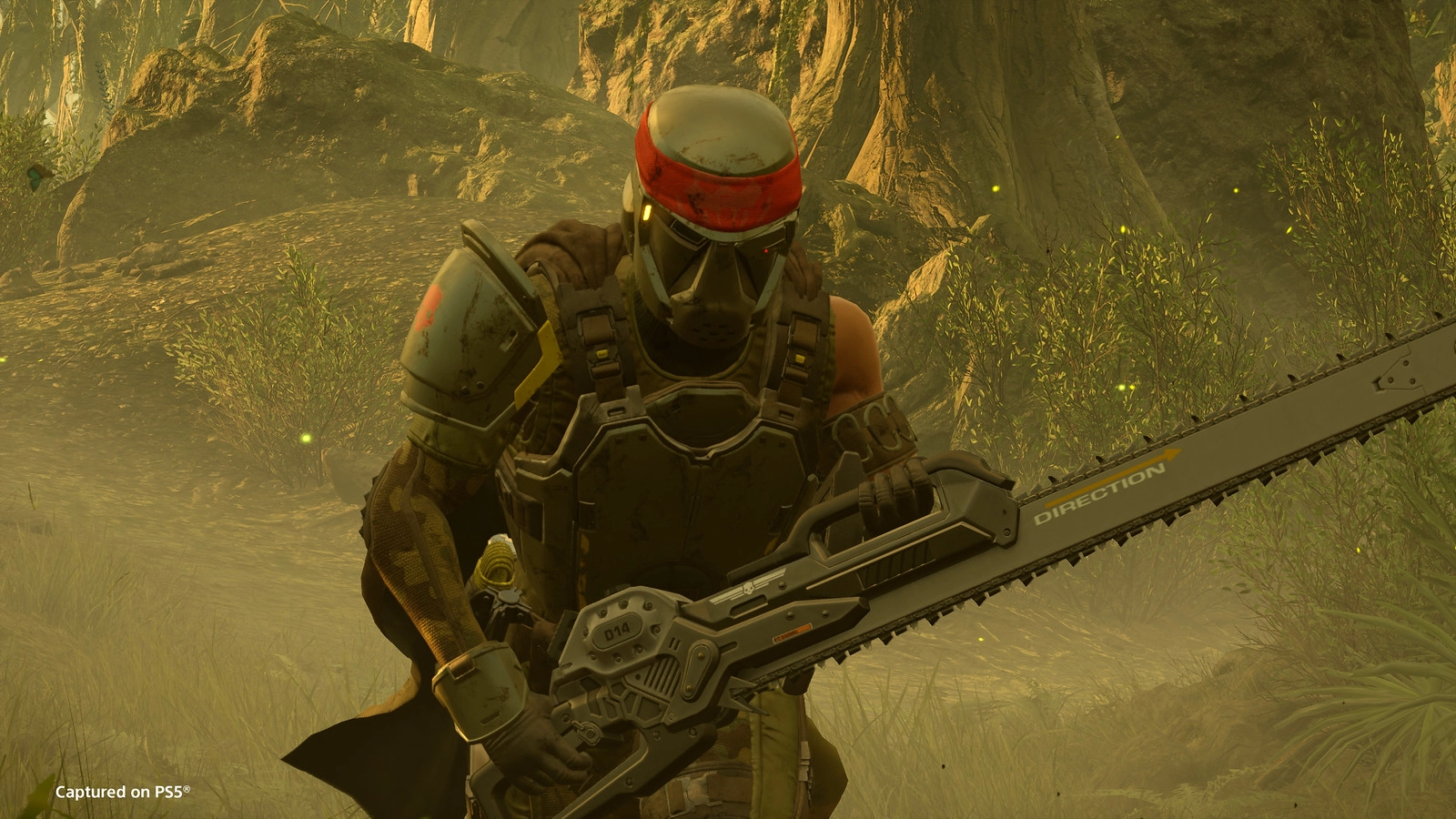 Helldiver in tactical gear wielding a chainsaw in a jungle setting, showcasing new weapons for combat readiness.