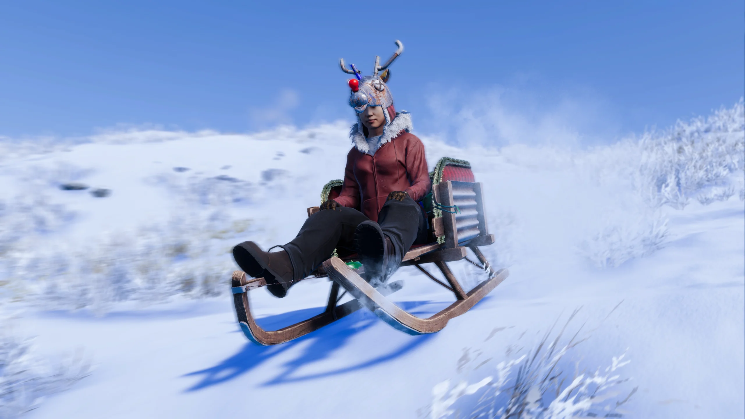 Player in festive attire racing on a sled through a snowy landscape in Rust Console Edition