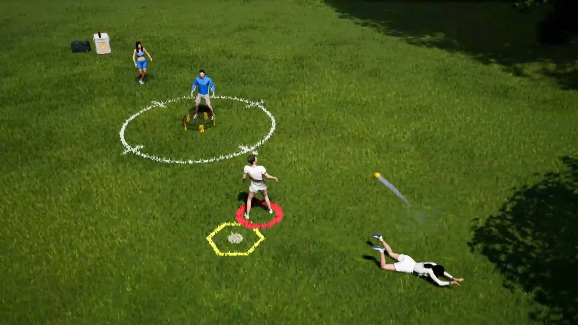 Players engage in a lively roundnet match on grass, showcasing Spikeball