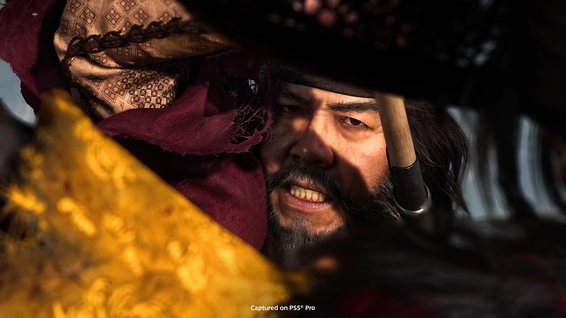 Intense close-up of a fierce character from Ghost of Yōtei, highlighting the dramatic climax of a battle scene.