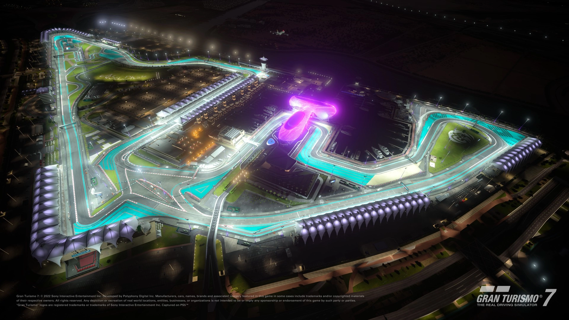 Gran Turismo 7 Spec III Update 1.65 showcases a vibrant racetrack illuminated at night, highlighting new cars and events.