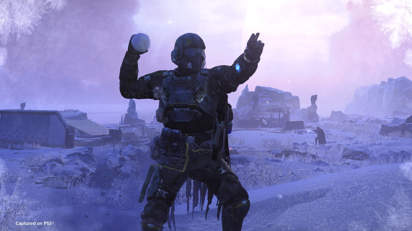 Helldivers 2 character celebrating the Festival of Reckoning, preparing to throw a snowball in a wintry landscape.