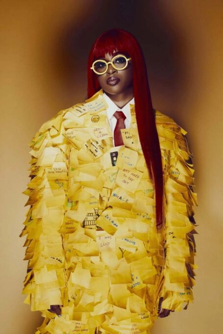 Ella Mental, the new character in Invincible VS, showcasing her vibrant personality in a stylish, sticky-note suit.