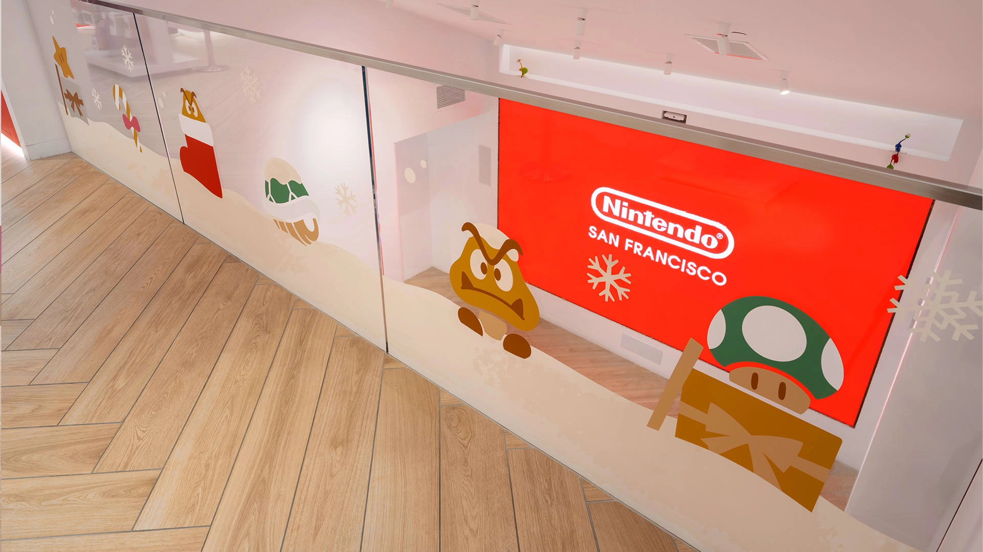 Festive Nintendo store display featuring holiday-themed decor and characters in San Francisco, inviting seasonal shopping.