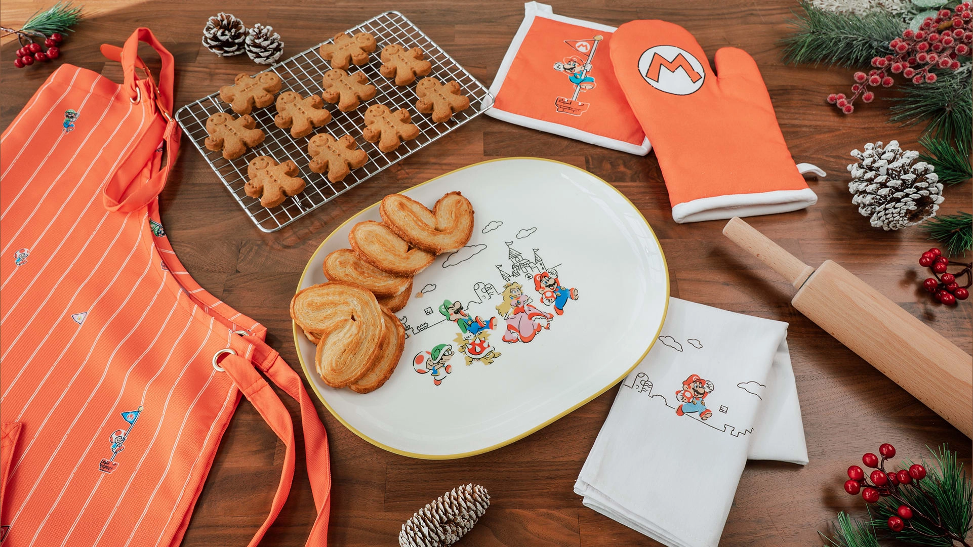 Festive Nintendo kitchen collection with baking accessories, cookies, and aprons, perfect for holiday celebrations.