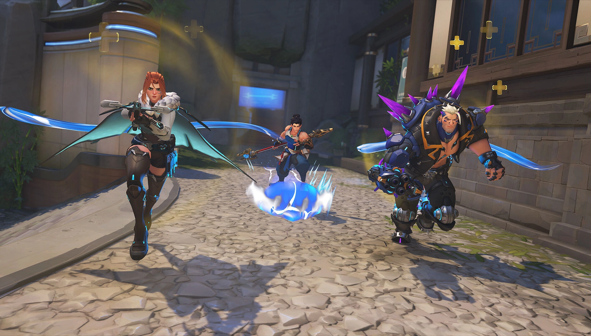Three Overwatch 2 heroes with dynamic poses showcase teamwork and action in a vibrant, game-inspired environment.
