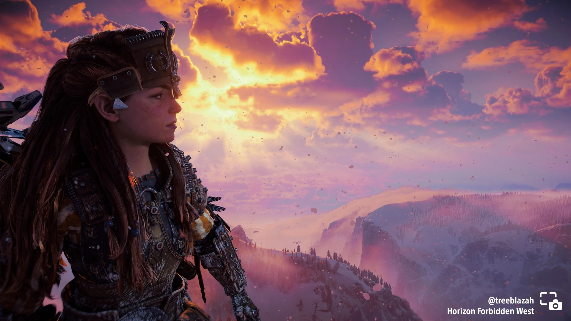 Aloy gazes at a breathtaking snowy vista during sunset in Horizon Forbidden West. #PSshare #PSBlog