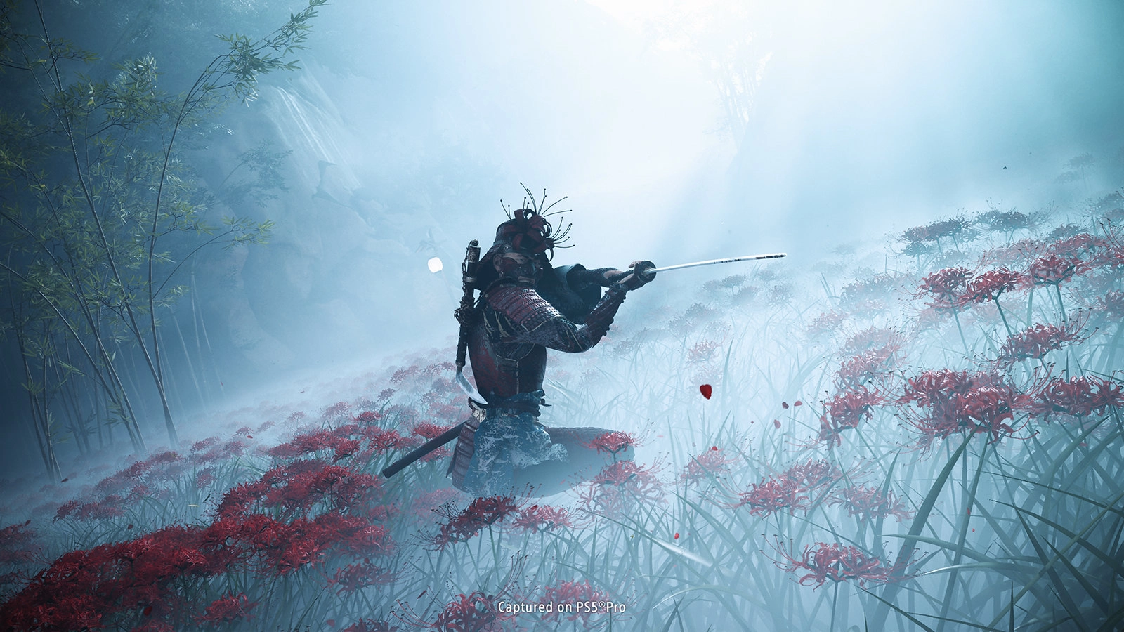 Atsu stands in a misty field of red spider lilies, poised by ominous wooden doors, hinting at a haunting adventure ahead.