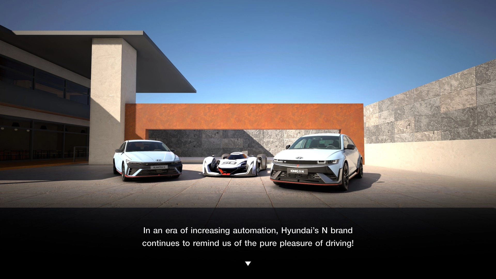 Three high-performance cars, including a Hyundai Elantra N TC, showcased in a modern courtyard setting