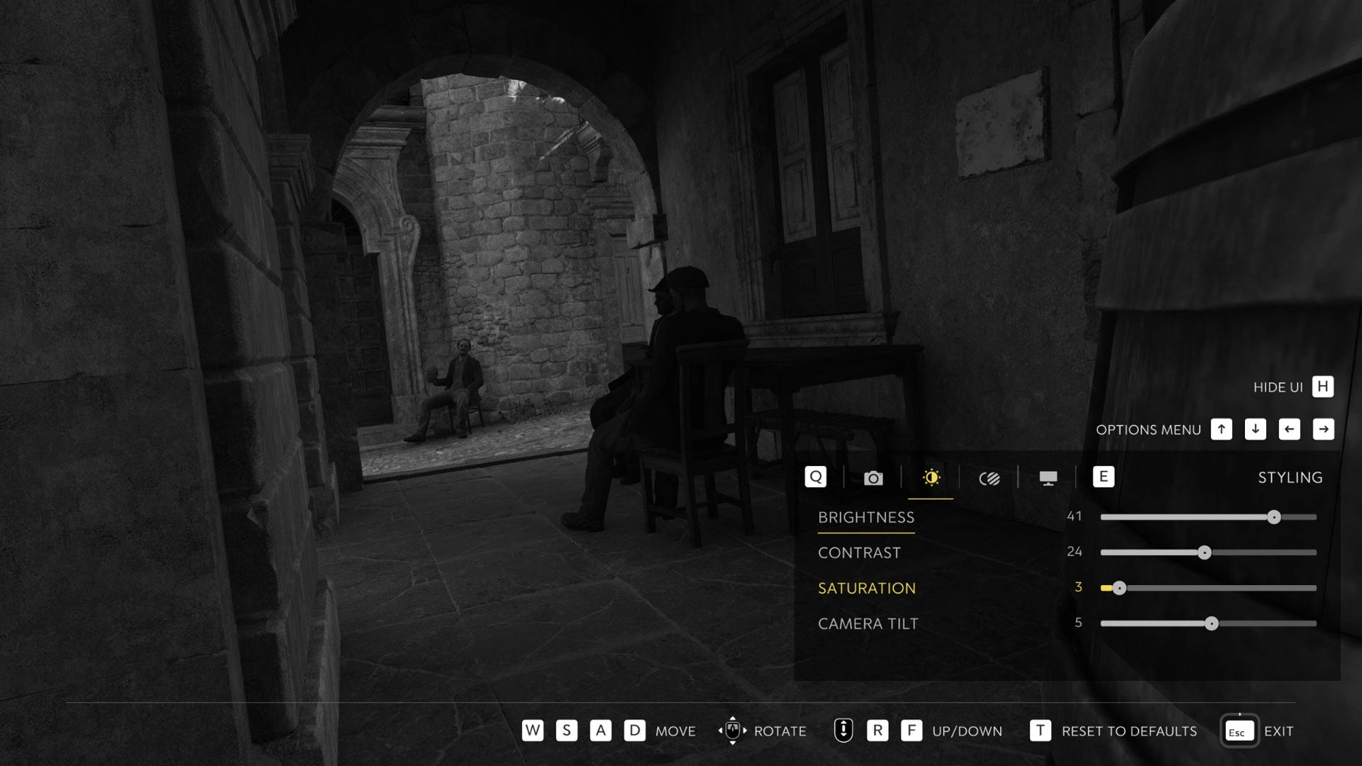 A black and white scene in a stone archway with two seated figures, showcasing Photo Mode settings