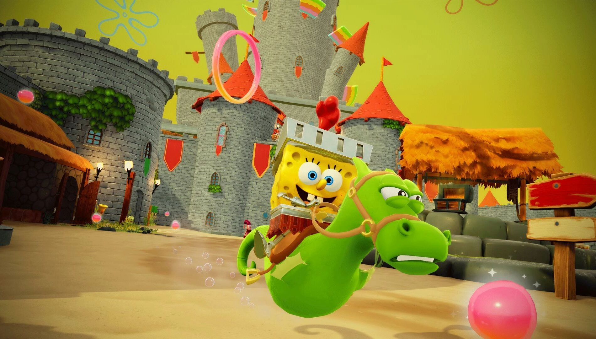 SpongeBob rides a green seahorse in a colorful medieval-themed setting with a castle in the background