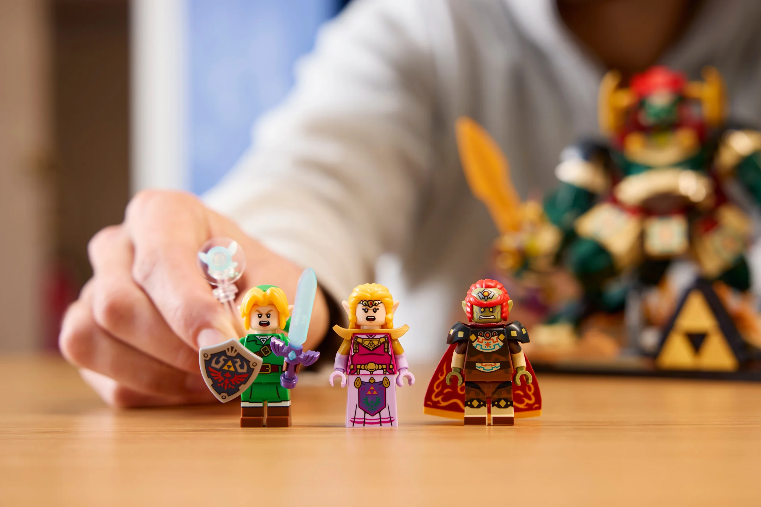 Link, Princess Zelda, and Ganondorf LEGO minifigures from Ocarina of Time displayed on a table