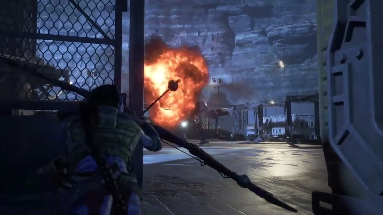 A character with a bow faces an explosion in a futuristic setting, showcasing action in Avatar: Frontiers of Pandora