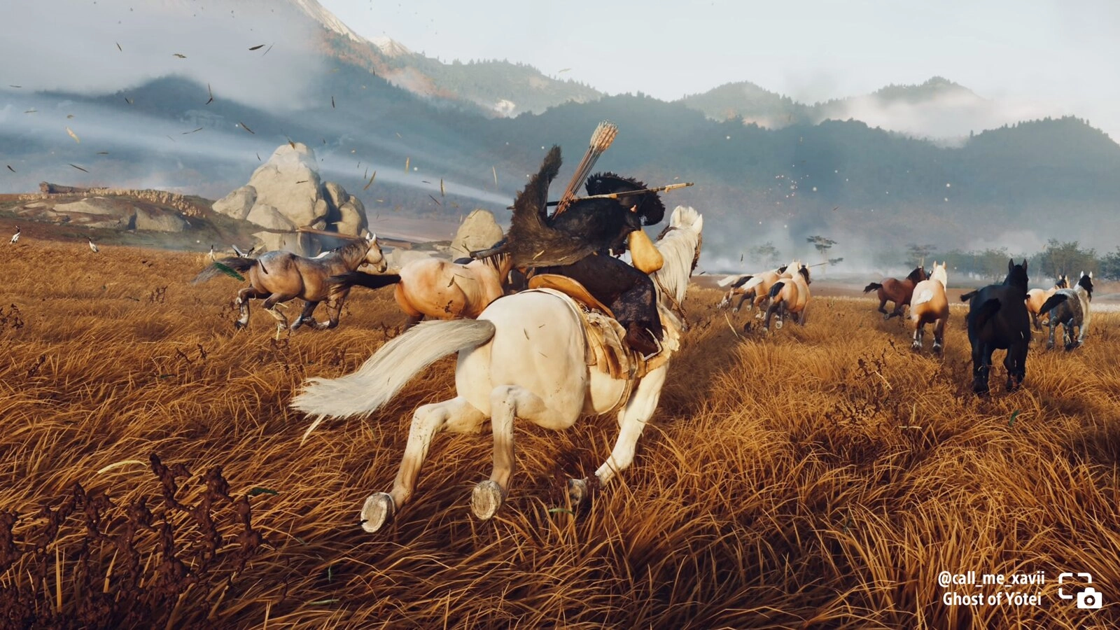 A rider on a white horse gallops through a field with a herd of horses in Ghost of Yōtei