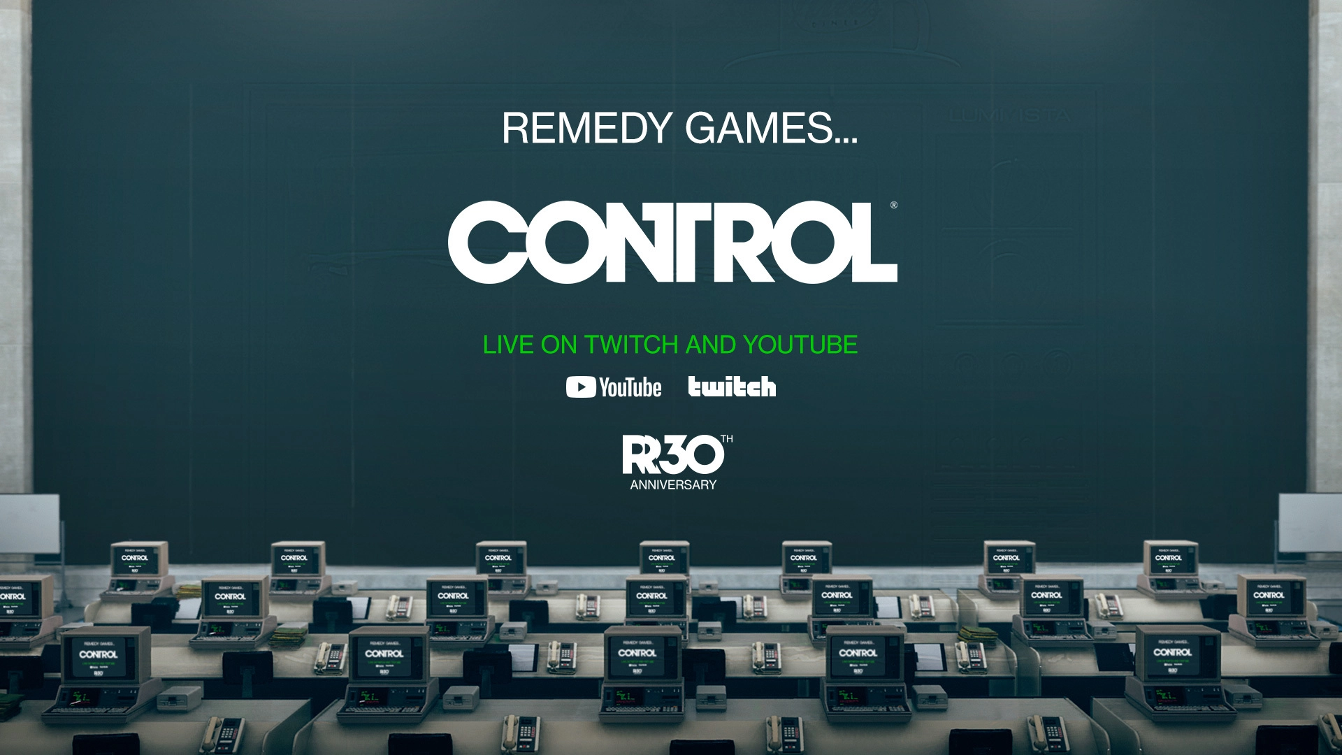 Rows of retro computers displaying "Control" in a dimly lit room, celebrating Remedy's 30th anniversary