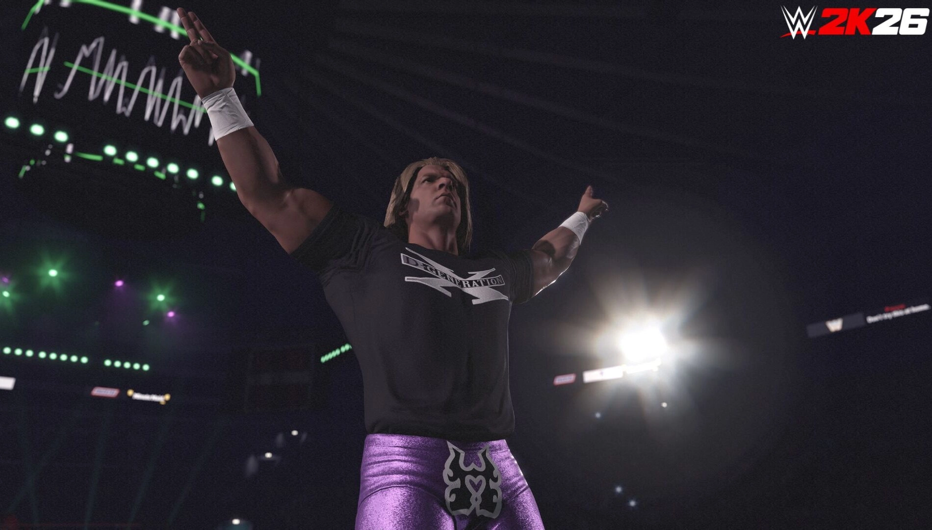 Wrestler in purple trunks and black shirt raises arms in WWE 2K26 arena, spotlight highlighting the scene