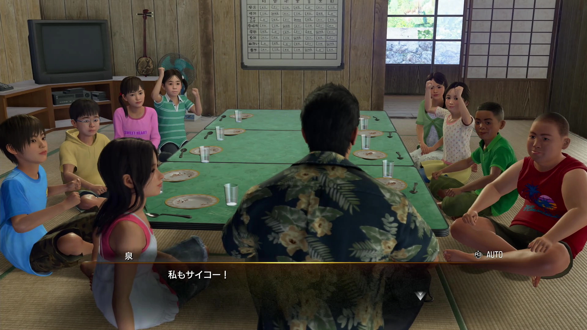 A group of children and an adult sit around a low table in a traditional Japanese room, engaging in conversation