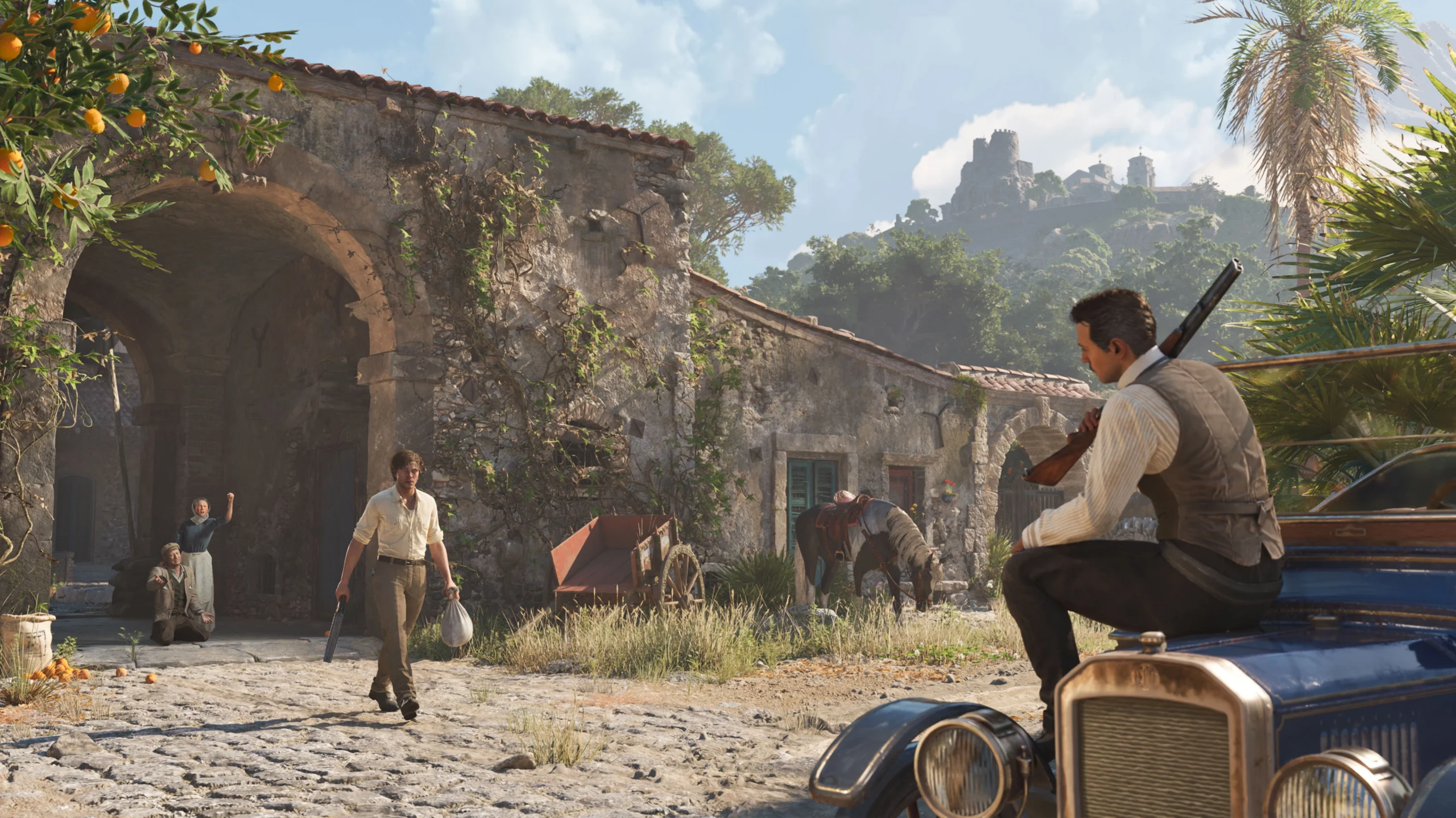 A man with a rifle sits on a vintage car in a rustic Sicilian village, another man approaches carrying a bag