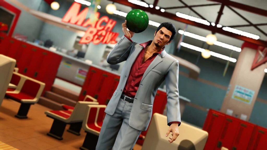 Kiryu in a bowling alley holding a green bowling ball, ready to play, with lockers and lanes in the background