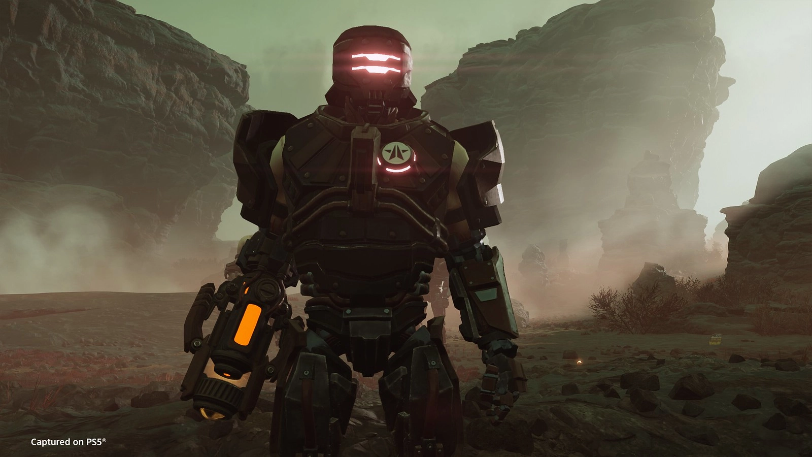 Cyborg warrior stands in a desolate, rocky landscape, illuminated by glowing lights amidst foggy terrain