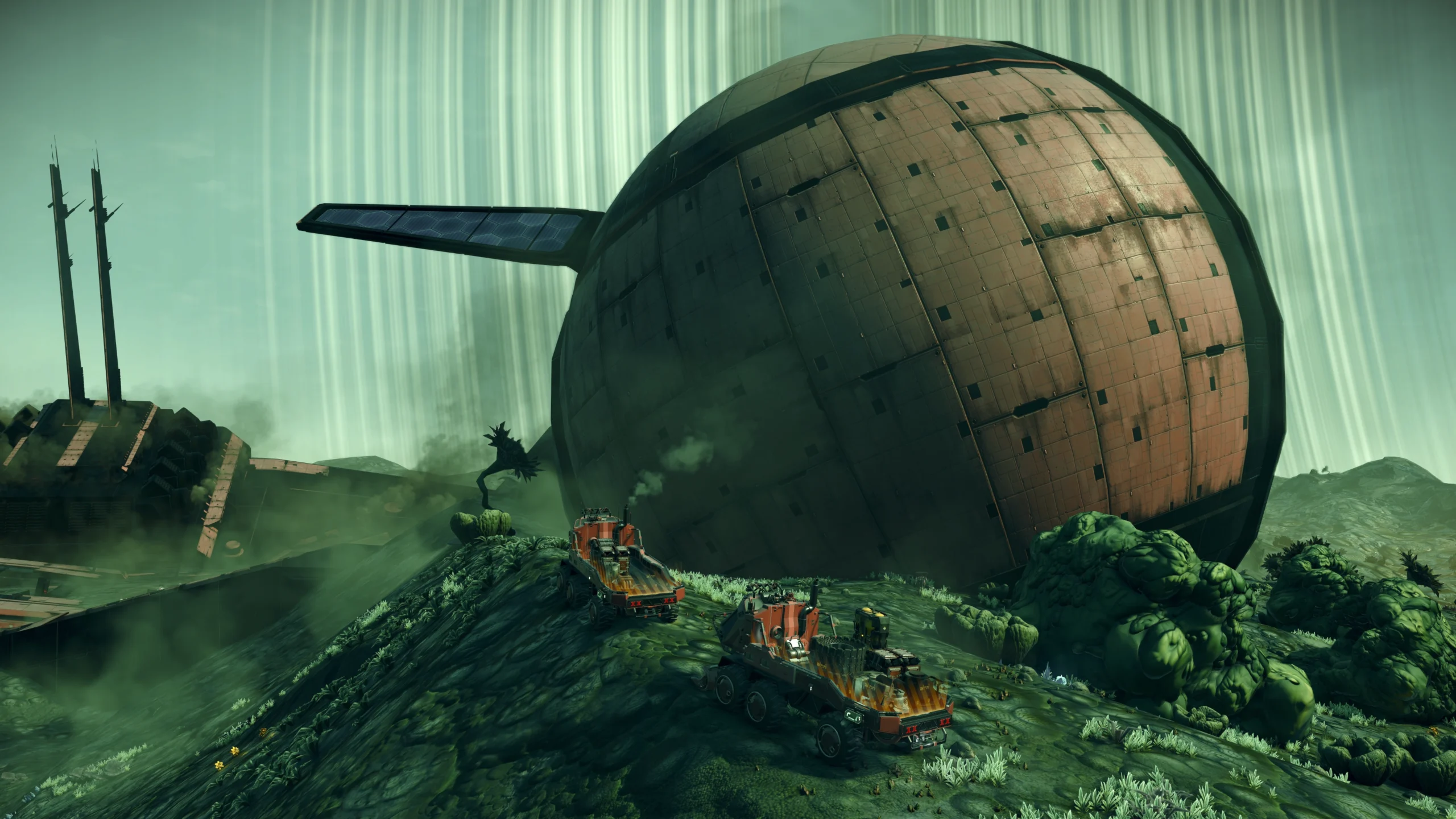Two trucks approach a massive, rusted spherical structure on an alien landscape in No Man's Sky
