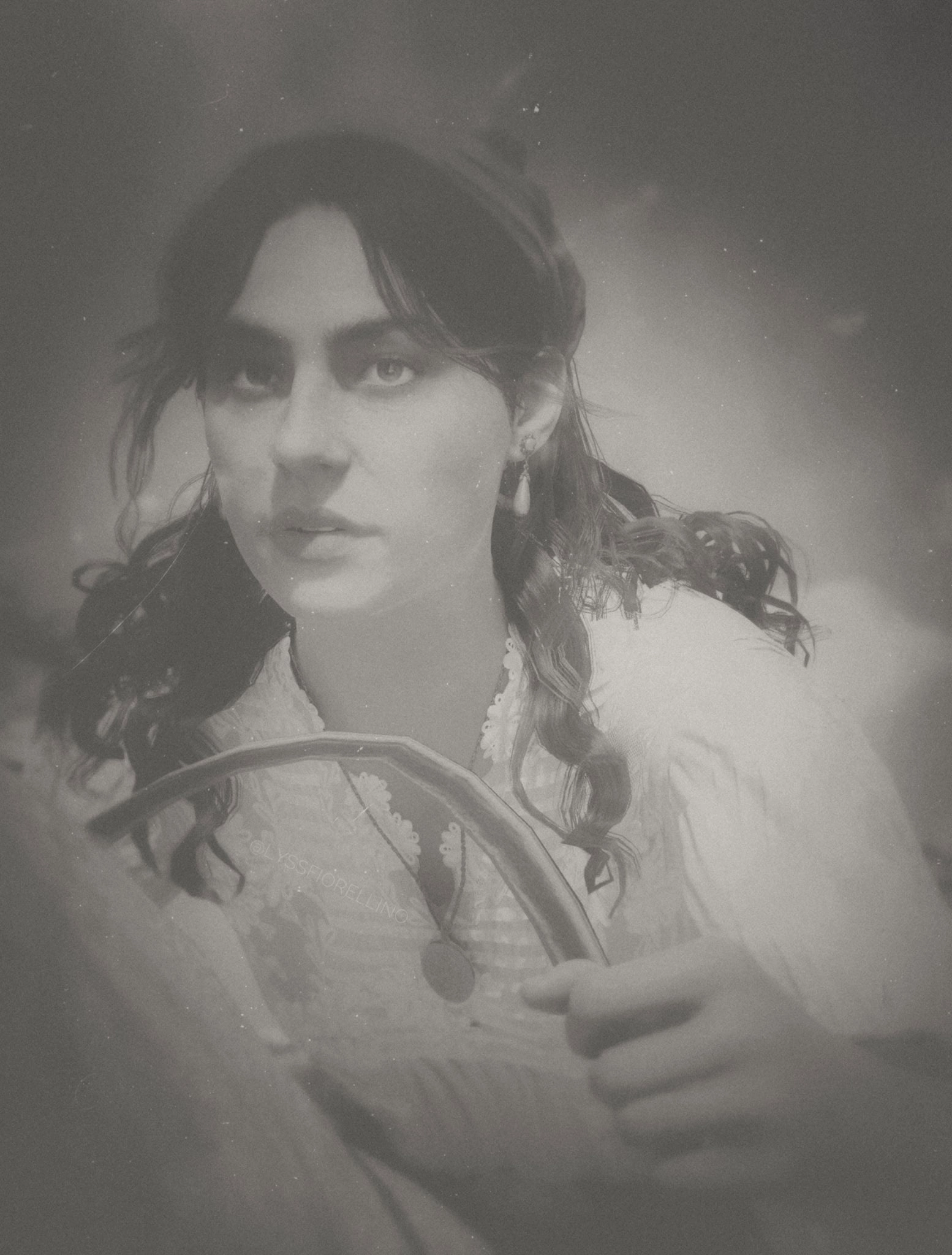 A woman with long hair and a focused expression, holding a steering wheel in a vintage, sepia-toned image