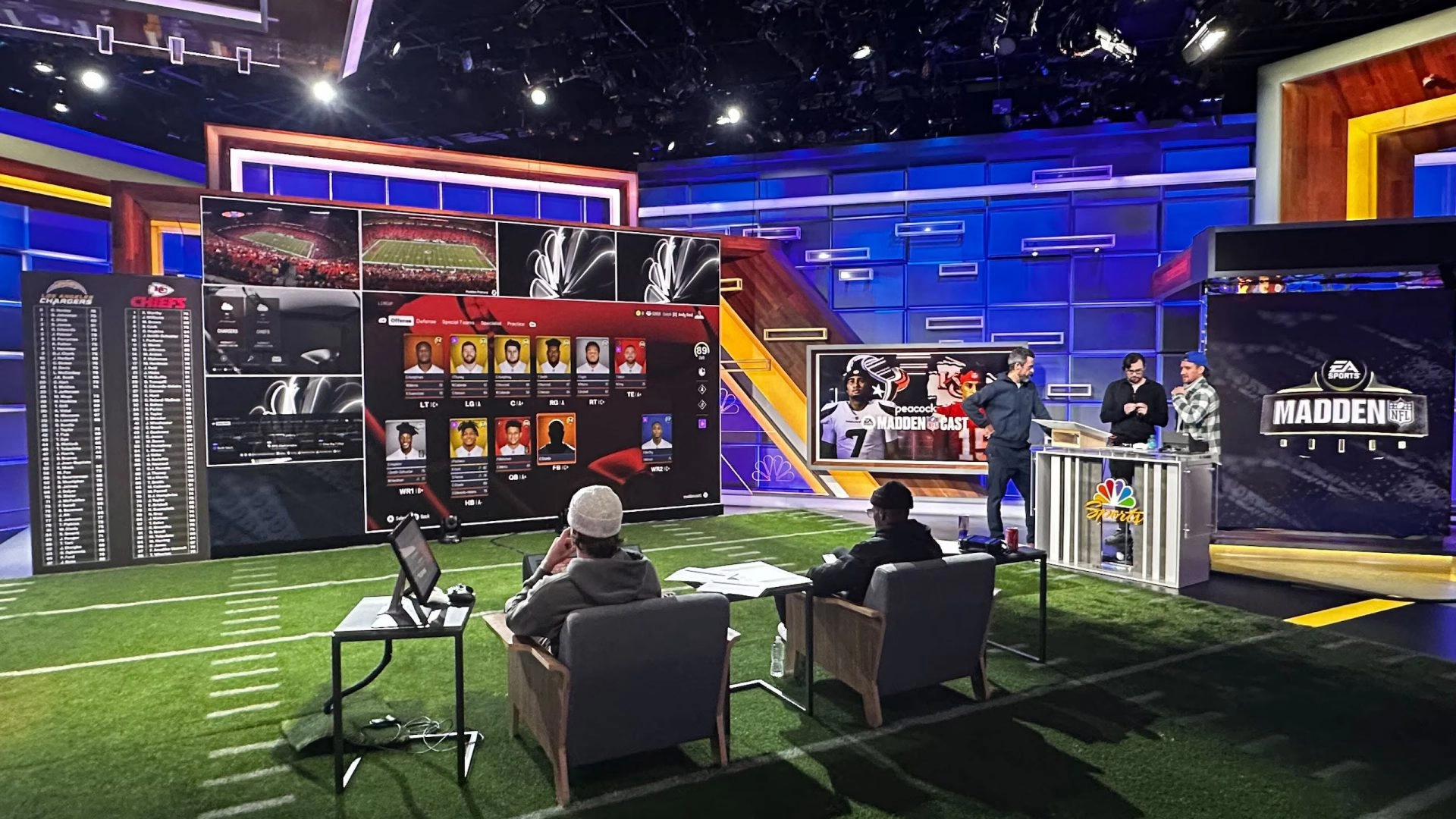 Studio setup with analysts discussing football strategies on large screens, showcasing Madden NFL insights