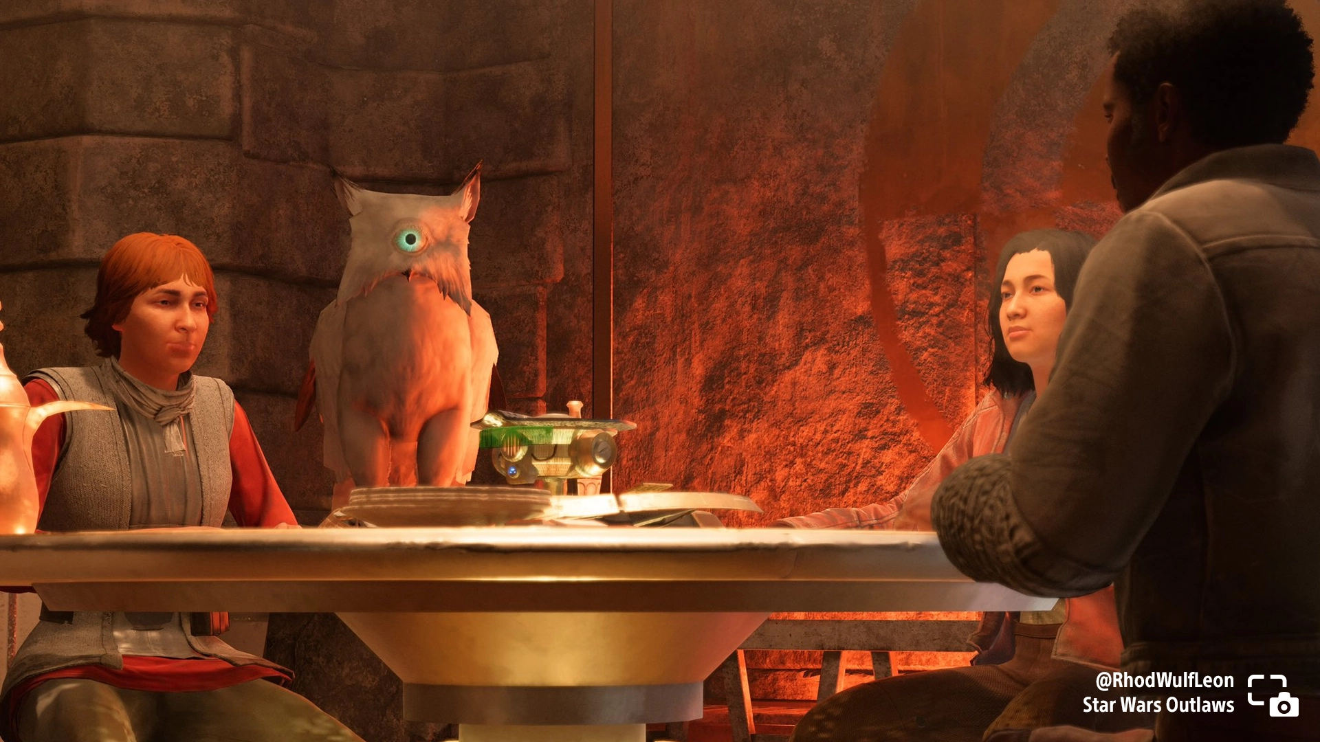 Three people and a one-eyed owl gather around a table in a cozy tavern setting in Star Wars Outlaws