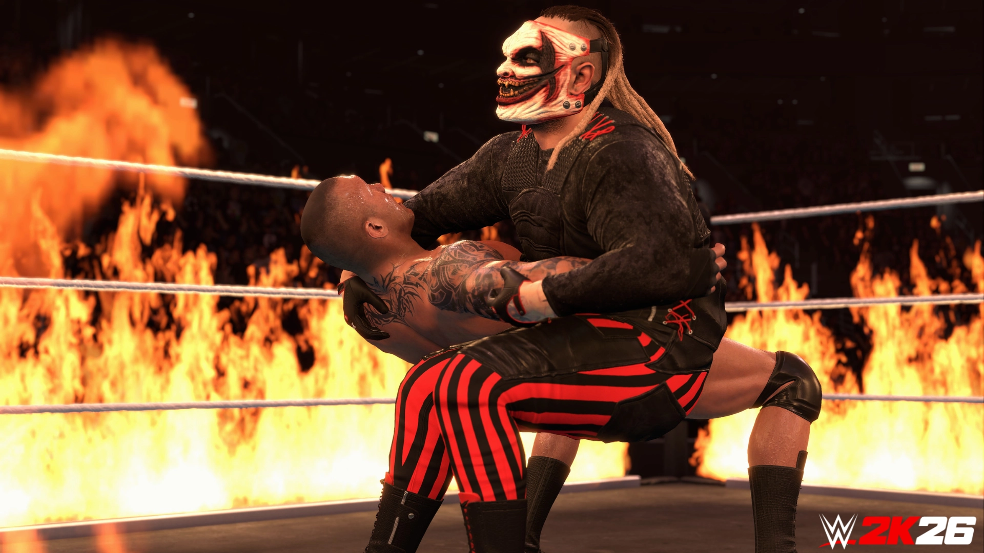 Wrestler in a mask grapples opponent in a fiery ring, showcasing intense WWE 2K26 gameplay action